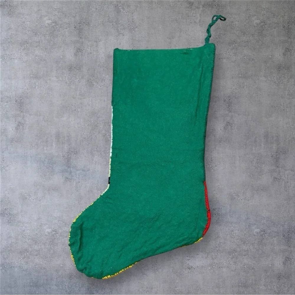 Vintage needlepoint Christmas stocking featuring design “Down The Bannister